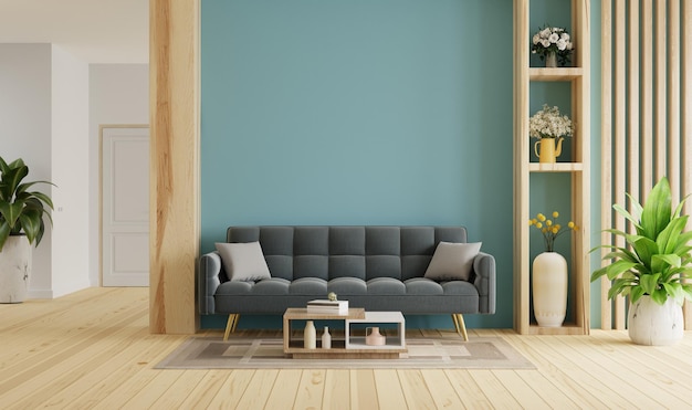 Intérieur de salon moderne confortable avec canapé sur fond de mur bleu foncé vide