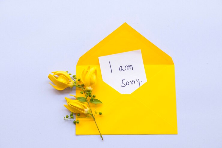 Photo je suis désolé message carte avec fleur ylang ylang