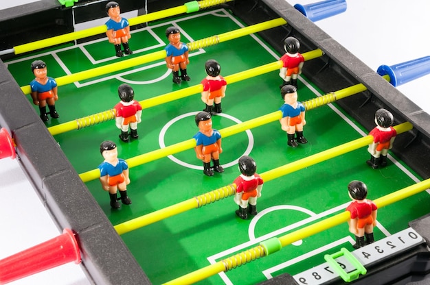 Photo jeu de jouet de football de baby-foot en plastique coloré classique