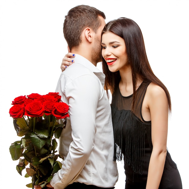 Jeune Beau Couple Avec Fleurs Sur Blanc