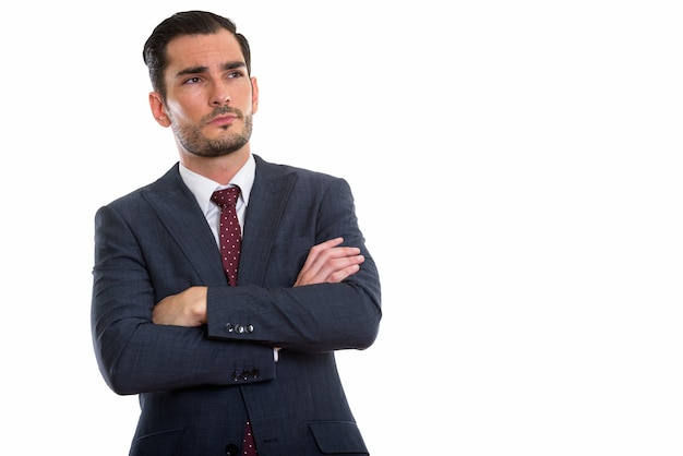 jeune bel homme d'affaires pensant avec les bras croisés