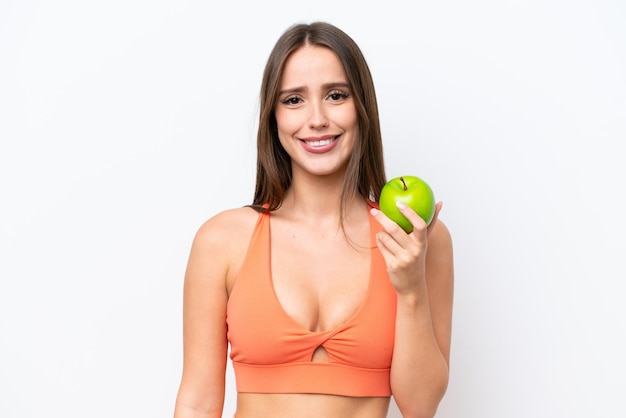 Jeune belle femme caucasienne isolée sur fond blanc avec une pomme