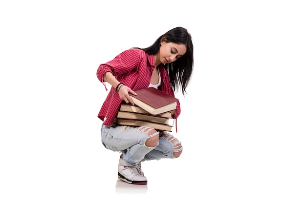 Jeune étudiante avec des livres isolés sur blanc