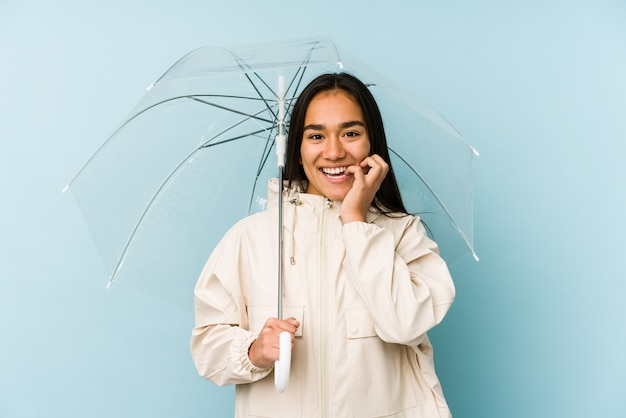 Jeune, femme asiatique, tenue, a, parapluie, mordre les ongles