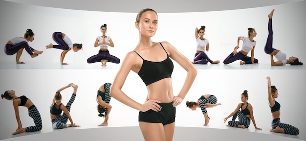 Jeune femme sportive faisant du yoga pratique isolée sur le mur du studio blanc