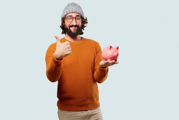 Jeune homme barbu avec une tirelire