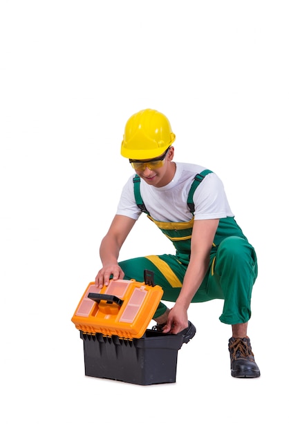 Jeune homme avec une boîte à outils isolé sur blanc