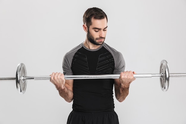 jeune homme de fitness sportif, faire des exercices avec haltères.