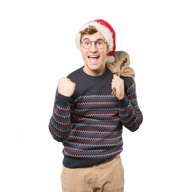 Jeune homme à Noël fait des gestes