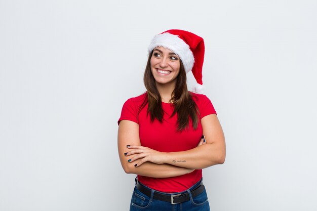 Jeune jolie femme avec Bonnet de Noel. Concept de Noël