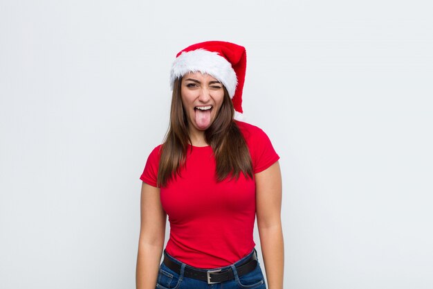 Jeune jolie femme avec Bonnet de Noel. Concept de Noël