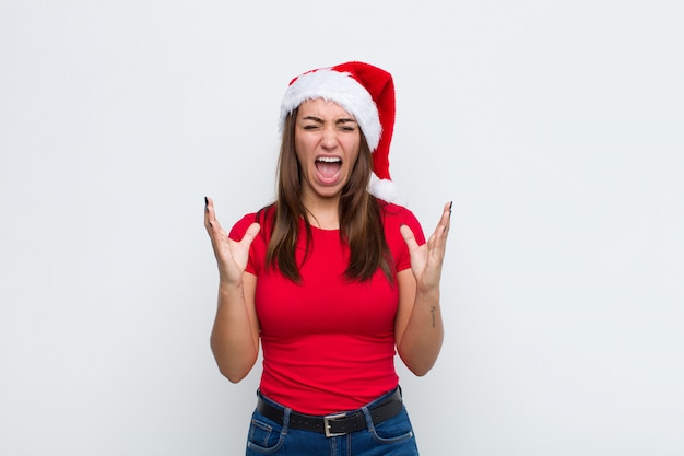 Jeune jolie femme avec Bonnet de Noel. Concept de Noël