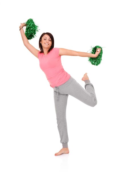 une jeune pom-pom girl posant sur blanc