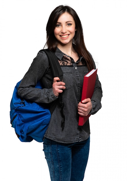 Jolie jeune fille étudiante avec cahier d'exercices isolé sur blanc