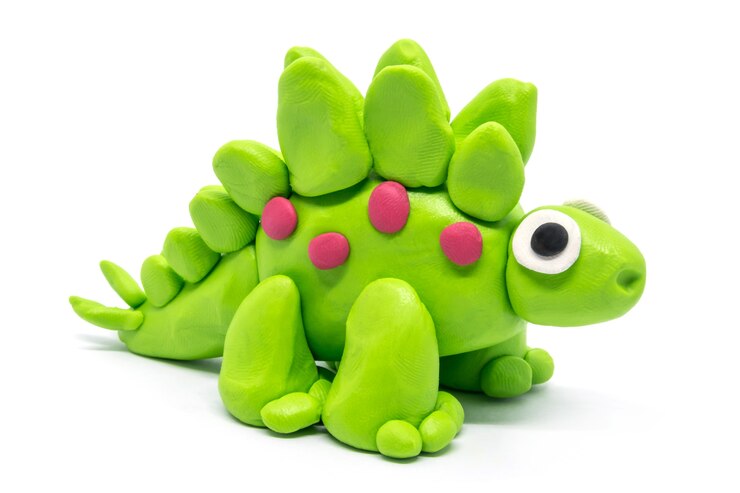 Jouer la pâte Stegosaurus sur blanc isolé
