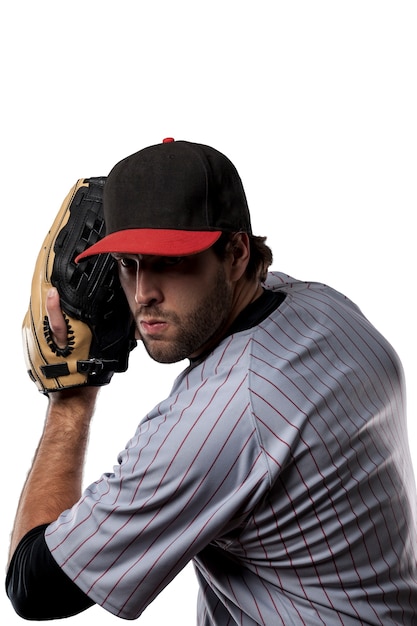 Photo joueur de baseball en uniforme rouge ,.