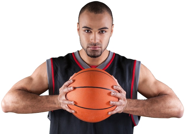 Joueur de basket tenant une balle - isolé