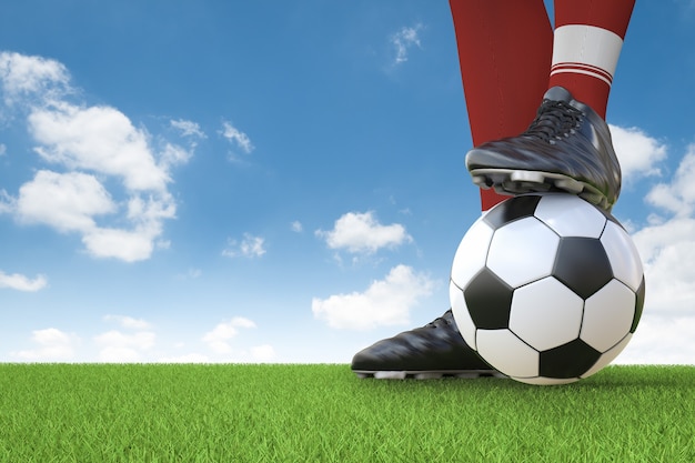 Joueur de football de rendu 3D debout avec un ballon de football