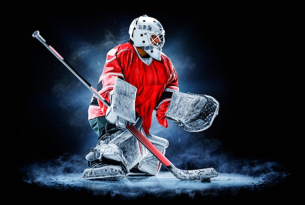 Photo joueur de hockey sur glace isolé sur fond noir