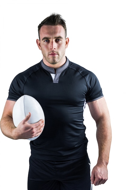 Joueur de rugby rugueux tenant la balle