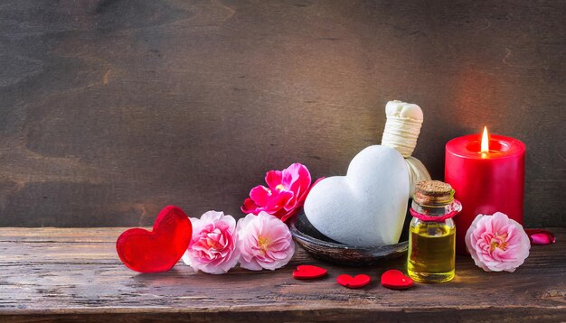 Photo jour de la saint-valentin zen et relaxation avec décoration de bien-être spa huile de massage et fond en bois