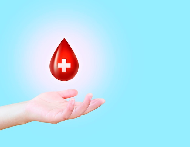Journée mondiale du donneur de sang Main avec l'icône de la goutte de sang