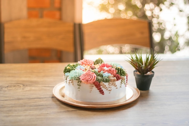 Photo joyeux anniversaire avec un gâteau de fleurs