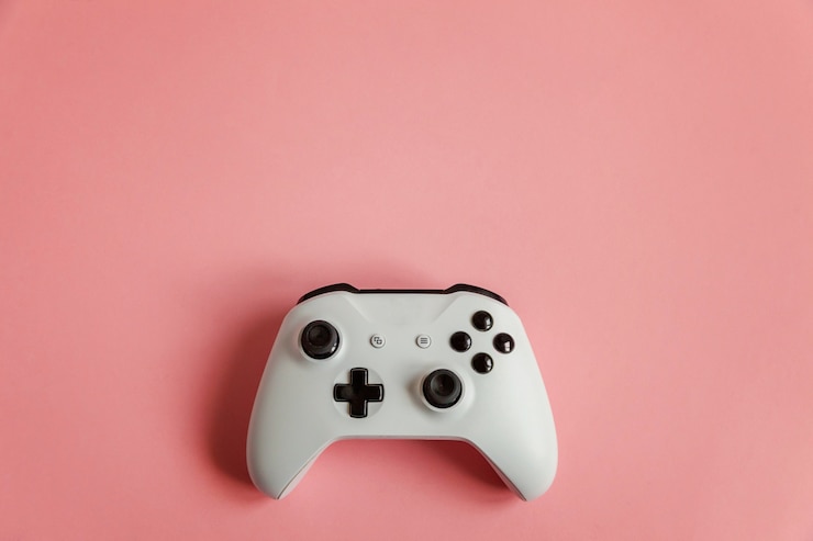 Photo joystick blanc sur rose