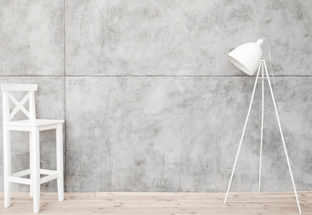 Photo lampadaire et tabouret blancs minimalistes avec panneaux en béton