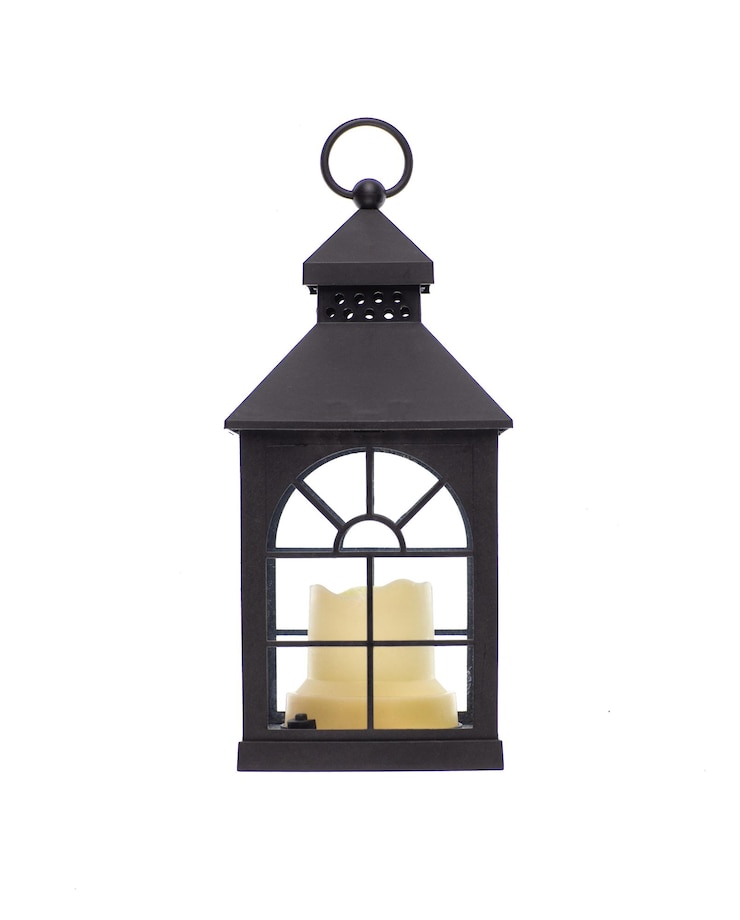 Photo lanterne vintage décorative de noël noire avec bougie isolée sur fond blanc