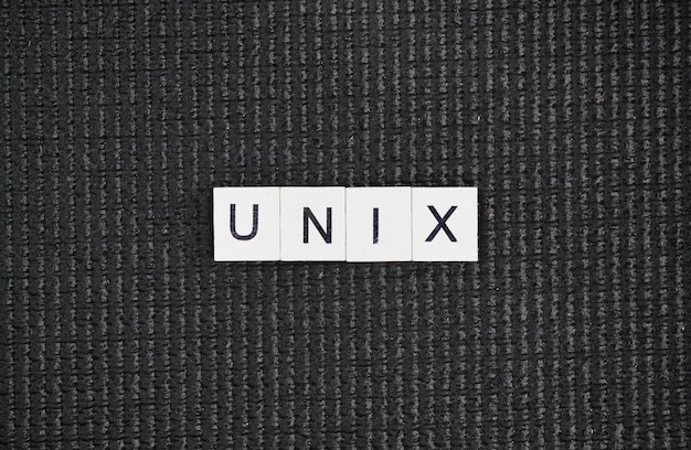 Laptop keyboard with the word UNIX Unix is a family of multitasking multiuser computer operating sys