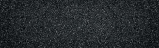 Large texture noire. Surface texturée gris foncé. Abstrait panoramique gris