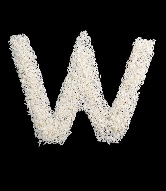 Photo lettre d'alphabet de grain de riz blanc