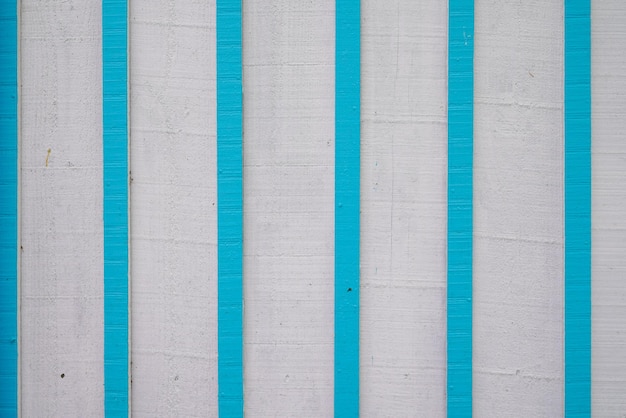 Ligne blanche bleue mur fond en bois patiné planches façade porte texture bois