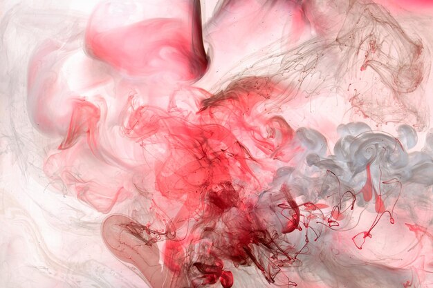 Liquide fluide art abstrait fond rose danse peintures acryliques sous-marine océan espace fumée