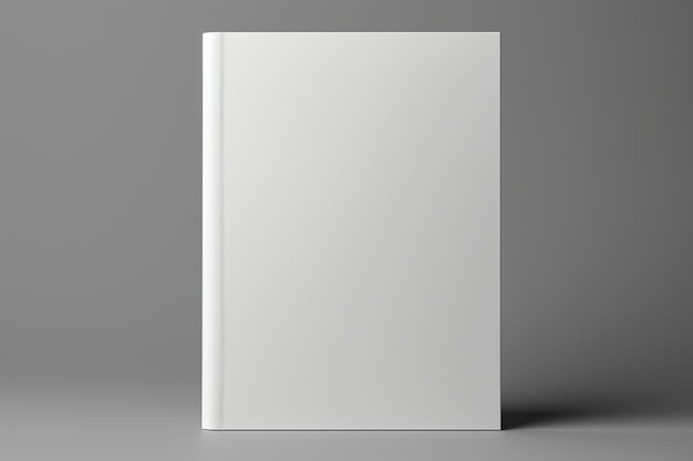 un livre blanc blanc sur une surface grise