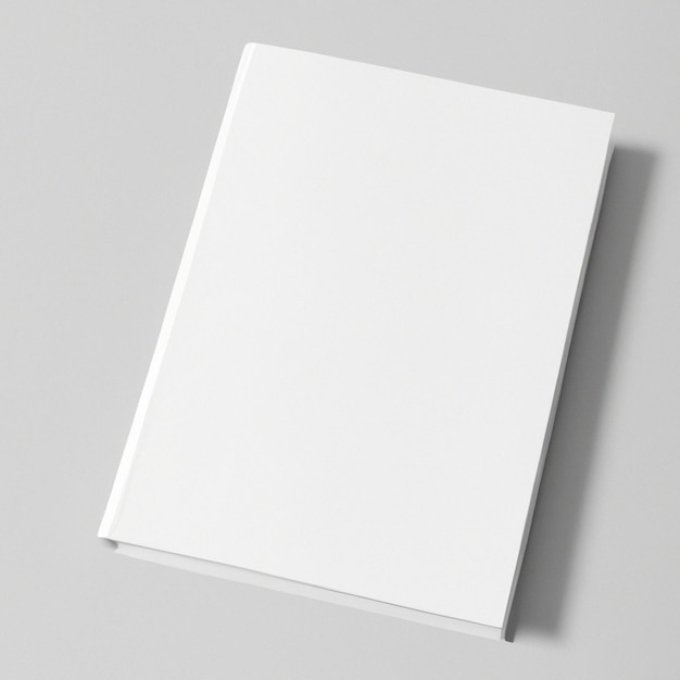 Photo un livre blanc avec une couverture blanche se trouve sur une surface grise.