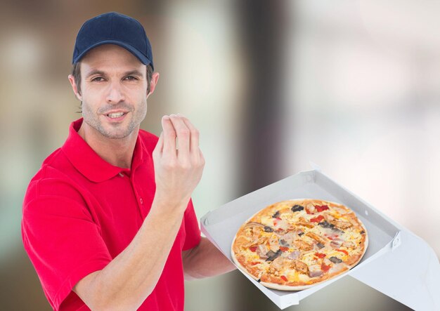 Photo livreur avec pizza arrière-plan flou