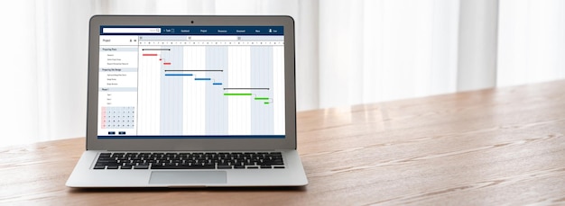 Logiciel de planification de projet pour la gestion de projet d'entreprise à la mode sur l'écran de l'ordinateur montrant le tableau chronologique du projet d'équipe