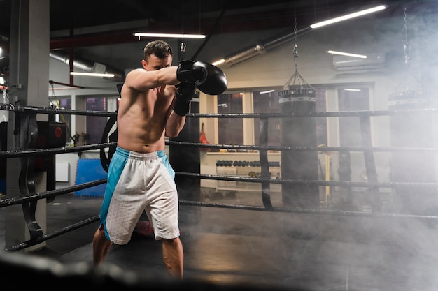 Long shot man training in boxing ring