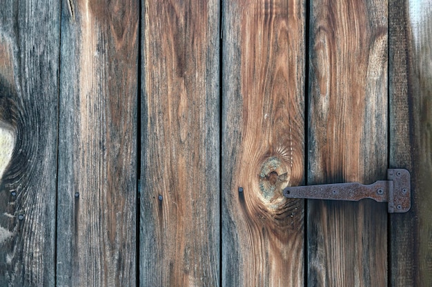 Loquet métallique sur une vieille porte en bois Fond en bois Texture bois