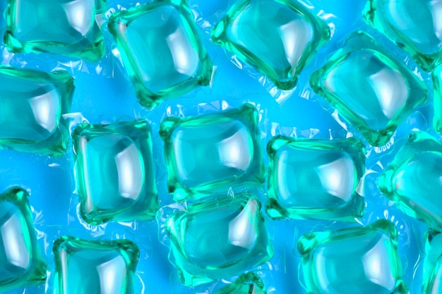 Lot de fond de capsules pour laver le vert sur fond bleu