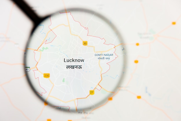 Photo lucknow, inde concept de visualisation de la ville sur l'écran d'affichage à travers la loupe