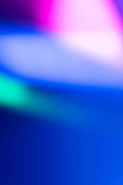 Lumière de couleur défocalisée Superposition de lueur au néon Rayons led fluorescents Flou taches holographiques bleu rose vert sur fond d'espace de copie abstraite sombre