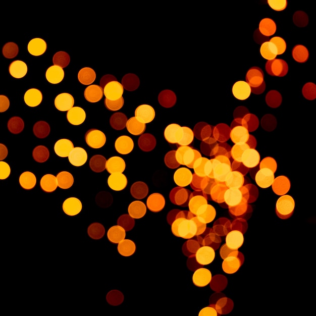 Lumières de bokeh orange abstraites non focalisées