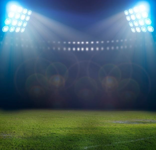 Photo lumières la nuit et stade de football