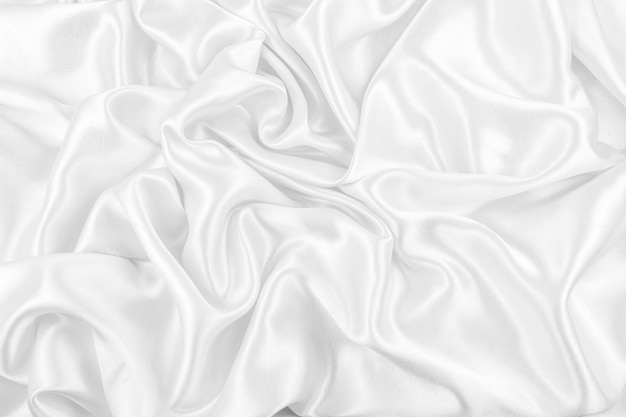 Luxueux fond de texture de tissu de soie blanche ou satin lisse