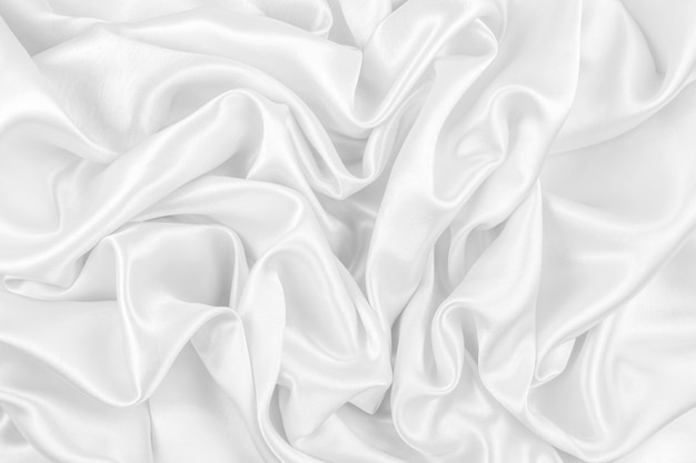 Photo luxueux fond de texture de tissu de soie blanche ou satin lisse