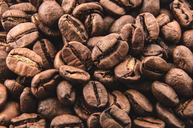 Macro de fond de grains de café torréfiés