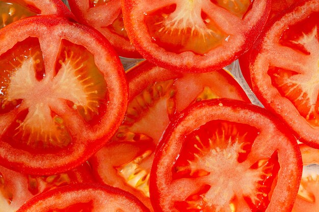 Macro Tomates Tranches de tomate Fond naturel avec des tranches de tomate